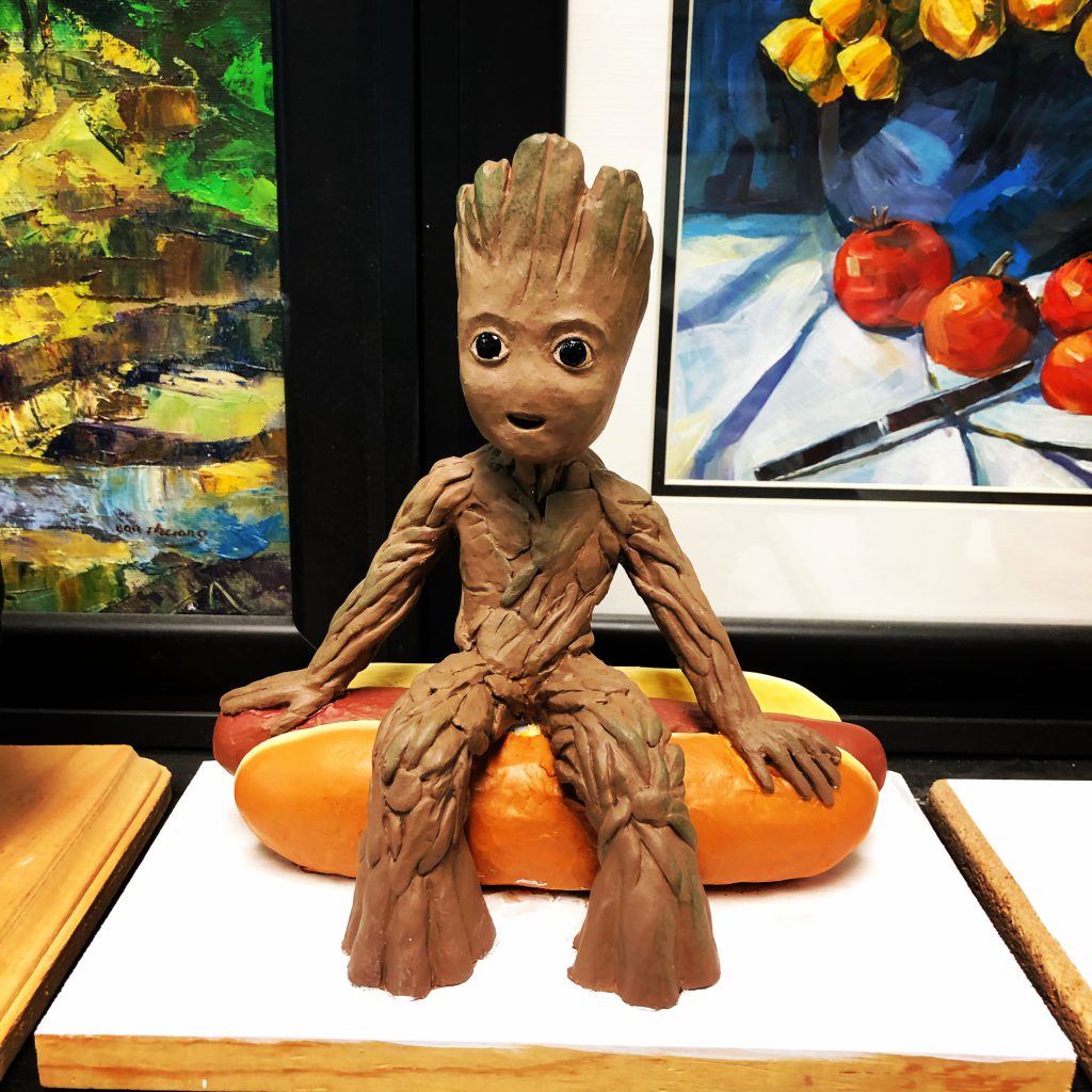 Teenage Groot on a hotdog